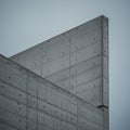 Modern architectural structure featuring geometric concrete forms. The surfaces Royalty Free Stock Photo