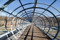 Detail of a pedestrian suspension wooden and steel footbridge Royalty Free Stock Photo