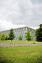 Modern architecture building full of windows during a storm Royalty Free Stock Photo