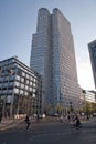 Modern architecture in City West, Berlin - The Upper West tower, a striking example of modern architecture, with street life and Royalty Free Stock Photo