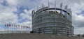 modern architecture of european union parliament with flags of members in france