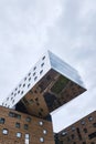 Modern architecture and futuristic cantilever of the nhow Berlin Hotel located directly on the banks of the river Spree