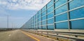 Modern architecture of the highway and the glass barrier