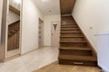 Modern architecture interior with elegant luxury hallway with glossy wooden staps stairs in modern storey house Royalty Free Stock Photo