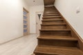 Modern architecture interior with elegant luxury hallway with glossy wooden staps stairs in modern storey house Royalty Free Stock Photo