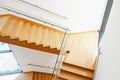 Modern architecture interior with wooden stairs Royalty Free Stock Photo