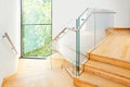 Modern architecture interior with wooden stairs Royalty Free Stock Photo