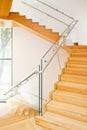 Modern architecture interior with wooden stairs Royalty Free Stock Photo