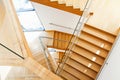 Modern architecture interior with wooden stairs Royalty Free Stock Photo