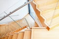 Modern architecture interior with wooden stairs Royalty Free Stock Photo