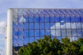 Modern architecture for office building with windows cloud reflexion on glass facade Royalty Free Stock Photo