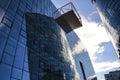 Modern architecture of office buildings. A skyscraper from glass and metal. Reflections in windows of blue sky. Business center Royalty Free Stock Photo