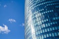 Modern architecture of office buildings. A skyscraper from glass and metal. Reflections in windows of blue sky. Business center. Royalty Free Stock Photo