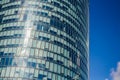 Modern architecture of office buildings. A skyscraper from glass and metal. Reflections in windows of blue sky. Business center Royalty Free Stock Photo