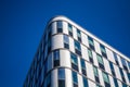 Modern architecture of office buildings. A skyscraper from glass and metal. Reflections in windows of blue sky. Business center. Royalty Free Stock Photo