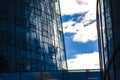 Modern architecture of office buildings. A skyscraper from glass and metal. Reflections in windows of blue sky. Business center Royalty Free Stock Photo