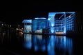 Modern architecture of Paul Loebe Building in Berlin at night with blue illumination