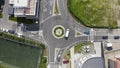 Aerial day shot above Buna Ziua district in Cluj, Romania. Top down roundabout traffic