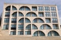 Modern architecture, unusual residential building facade with circular arch glass balconies