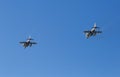 Modern armed military fighter jets flys in formation through the sky