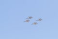 Modern armed military fighter jets flys in formation through the sky