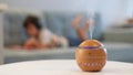 Modern aroma oil diffuser on the white table. Little boy in the background reading a book Royalty Free Stock Photo