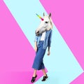 Modern art collage. Woman with unicorn`s head on color background Royalty Free Stock Photo