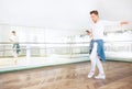 Modern art dancer dressed in white clothes listening a music wit Royalty Free Stock Photo