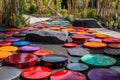 modern art installation with stepping stones, metal sculptures, and vibrant colors