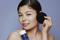 modern asian woman with makeup remover and black cotton pad Royalty Free Stock Photo