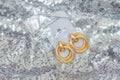 Modern asymmetrical golden earrings with layered rings Royalty Free Stock Photo