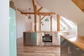 Modern attic white bright kitchen in the loft apartment