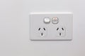 Double power outlet on white wall. Royalty Free Stock Photo