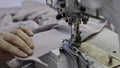 Modern and automatic high technology sewing machine for textile or clothing apparel. Media. Close up of sewing process. Royalty Free Stock Photo