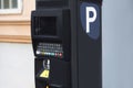 Modern automatic pay Parking meter or ticket payment station  on a street allow parkers, car drivers pay by card or cash Royalty Free Stock Photo