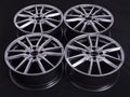 Modern automotive alloy wheel made of aluminum on a black background, industry. Designer fashion wheels for car Royalty Free Stock Photo