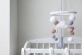 Modern baby mobile under crib in children\'s room Royalty Free Stock Photo