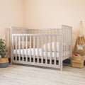 Modern baby room interior with a cozy classic crib with some decorative accessories on sides Royalty Free Stock Photo