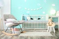 Modern baby room interior with crib Royalty Free Stock Photo