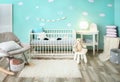 Modern baby room interior with crib Royalty Free Stock Photo