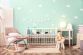 Modern baby room interior with crib