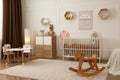 Modern baby room interior with stylish furniture and toys Royalty Free Stock Photo