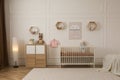 Modern baby room interior with stylish furniture and toys Royalty Free Stock Photo