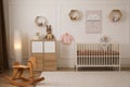 Modern baby room interior with stylish furniture and toys Royalty Free Stock Photo