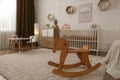 Modern baby room interior with stylish furniture and toys Royalty Free Stock Photo