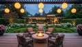 Modern backyard patio with fire pit and hanging lights Royalty Free Stock Photo
