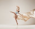 Modern ballet dancer dancing in full body on white studio background. Royalty Free Stock Photo