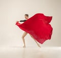 Modern ballet dancer dancing in full body on white studio background. Royalty Free Stock Photo