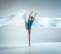 Modern ballet dancer dancing in full body on white studio background. Royalty Free Stock Photo