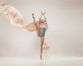 Modern ballet dancer dancing in full body on white studio background. Royalty Free Stock Photo